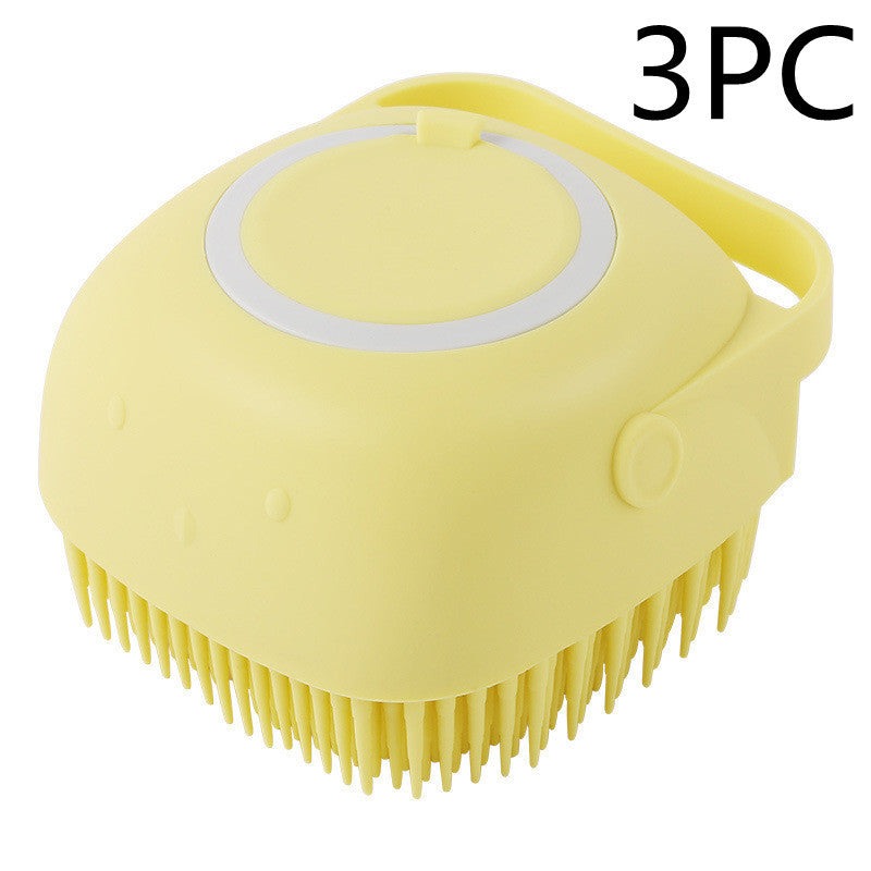 Yellow silicone dog bath massage brush with soft bristles and handle