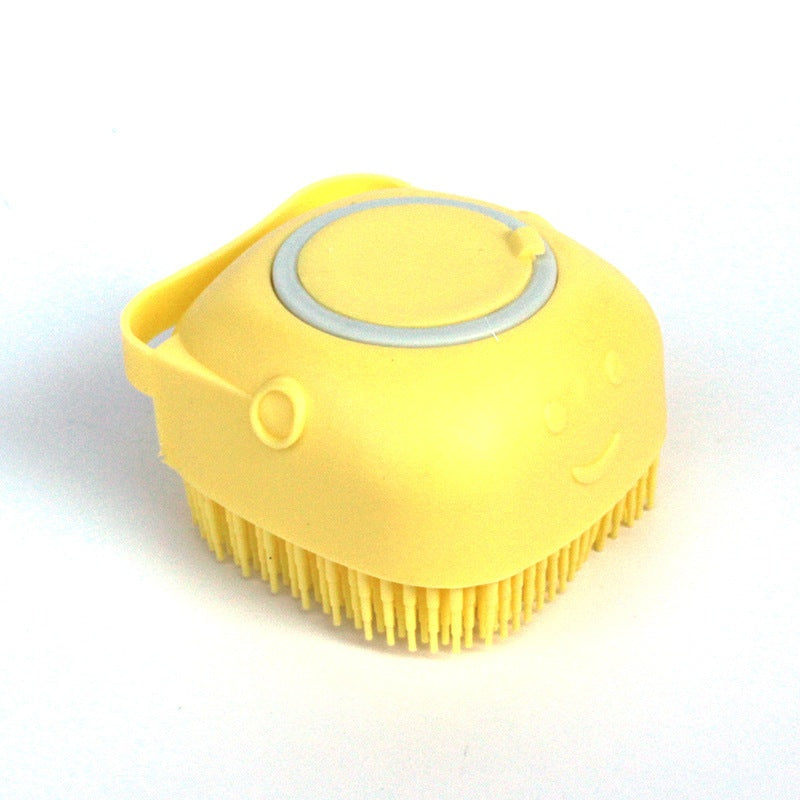 Yellow silicone dog bath massage glove with soft bristles for gentle pet grooming and shampoo dispensing